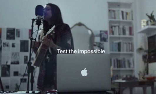 Branding - Brand strategy - image of a computer with an apple in the middle and the text above it: "Test the impossible".